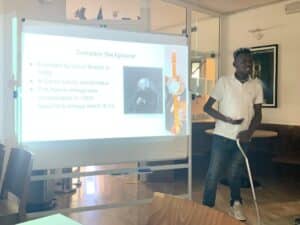 students makes a presentation during travel abroad trip