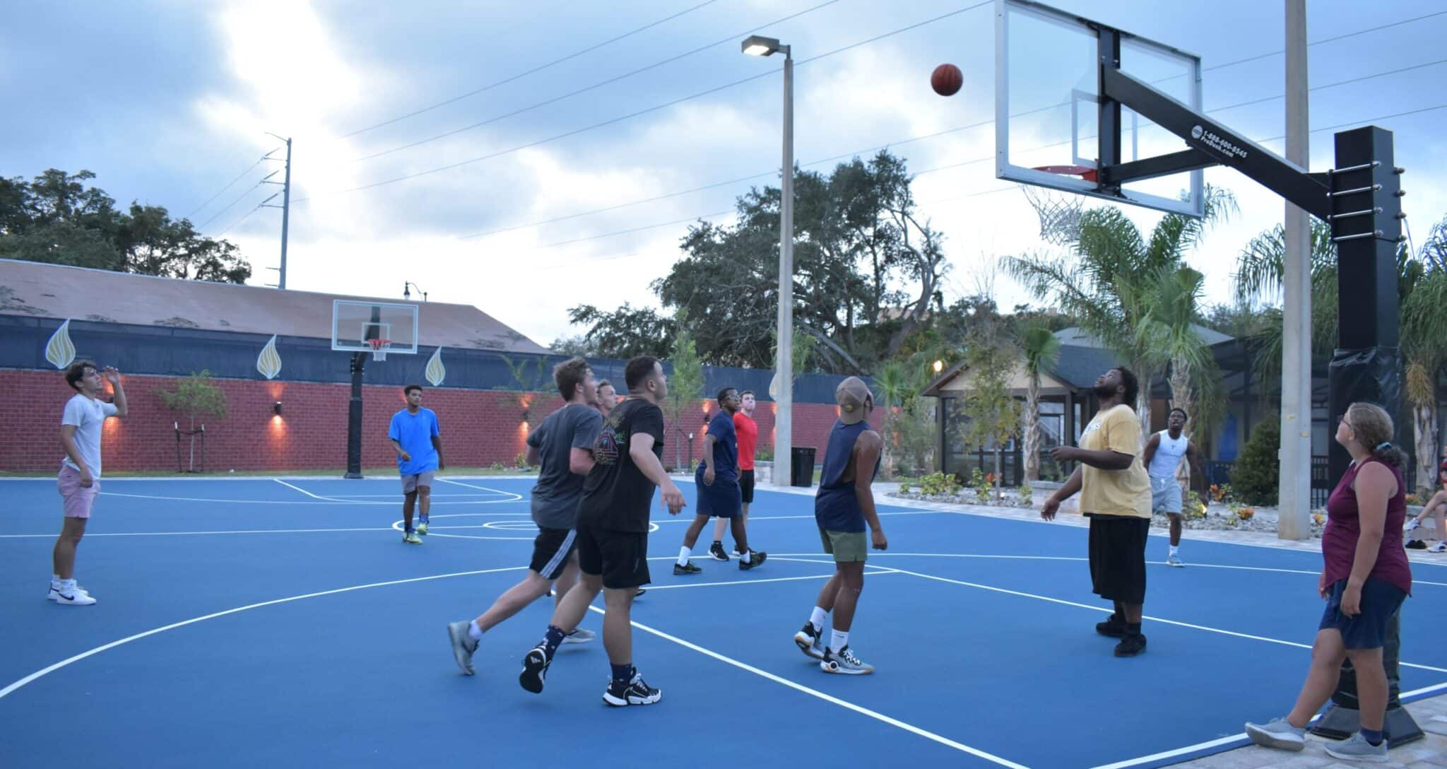 students playing basketball at the Oasis